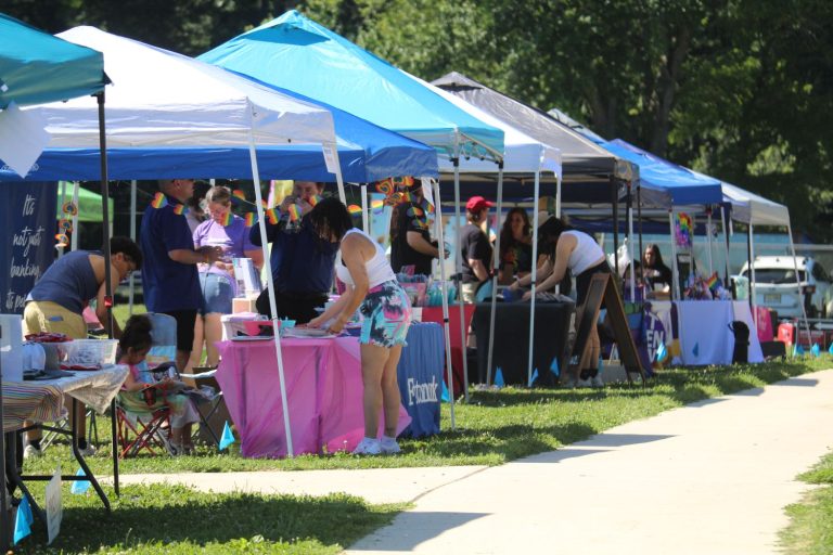 Vendors line the sidewalk at Apple Farms this past weekend at the inaugural event