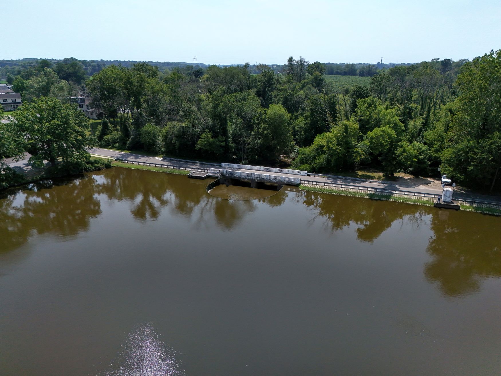 Made in 1922 the U-shaped spillway and earthen dam with bridge atop Memorial Lake Dam