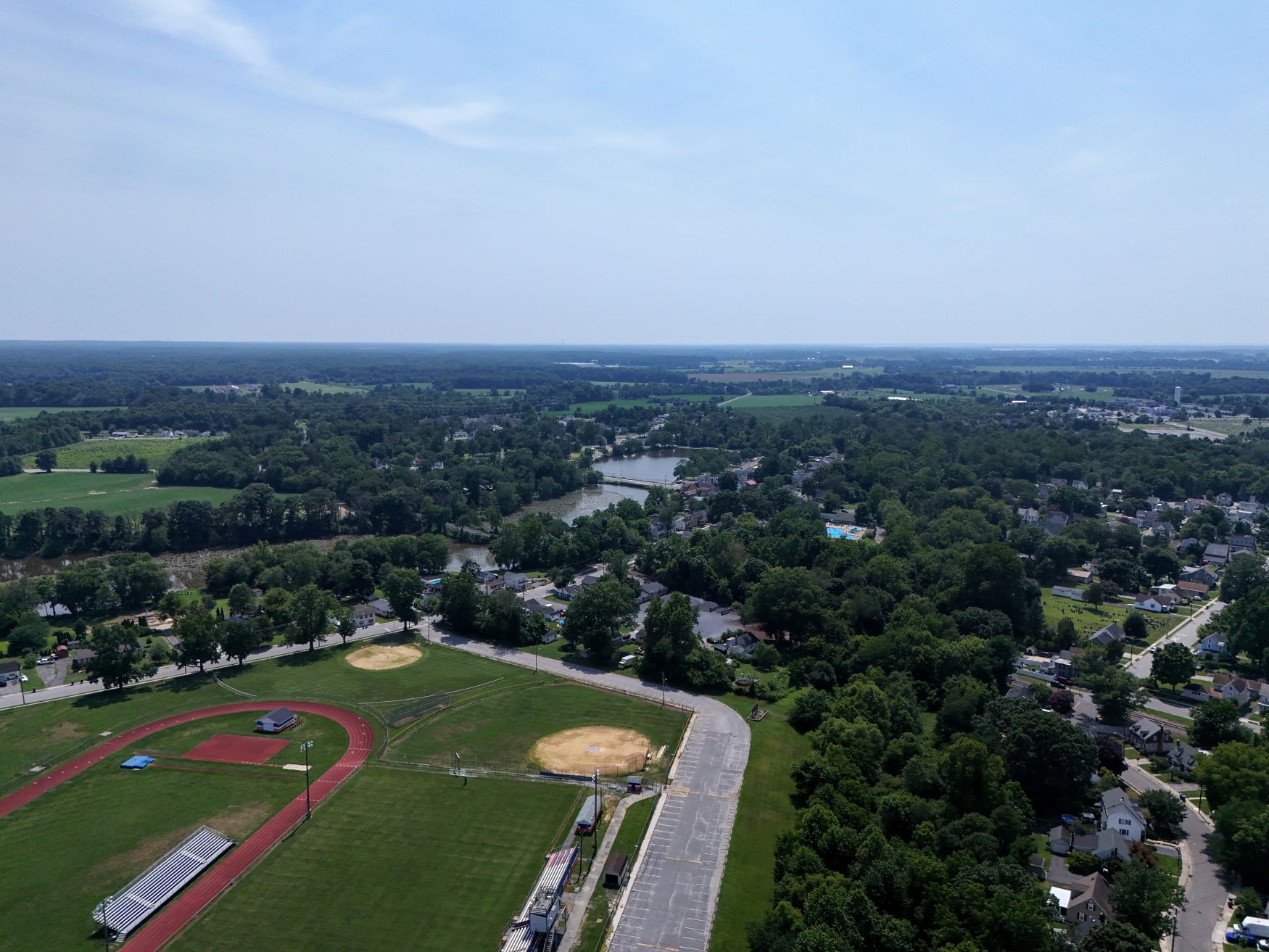 Veteran Memorial Lake in the distance from above the local high school football stadium
