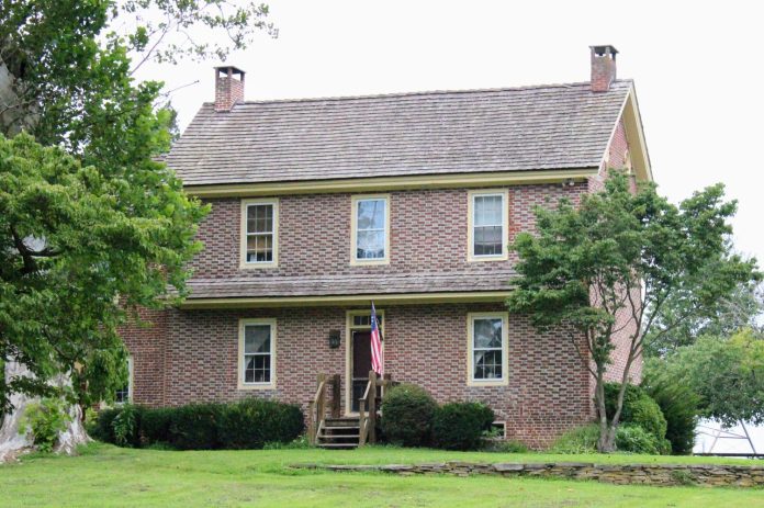 The John Jarman House today. Its brick front and symmetrical window placement are little changed from the descriptions recorded by historians in 1949 and 1976.