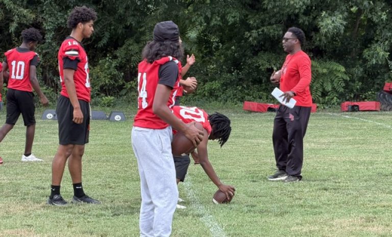 New Penns Grove football coach Damian Ware lines up his offense during the early days of training camp.