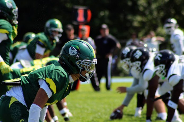 The new helmets of the Mighty Oaks shine in the bright sunshine yesterday during the first ever SCC Football game The new helmets of the Mighty Oaks shine in the bright sunshine yesterday during the first ever SCC Football game